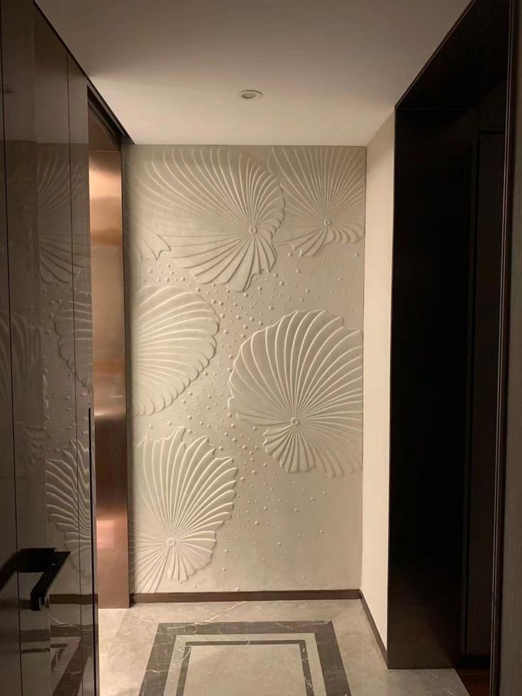 an elegant bathroom with white walls and marble flooring is pictured in this image, there are no people or objects on the wall