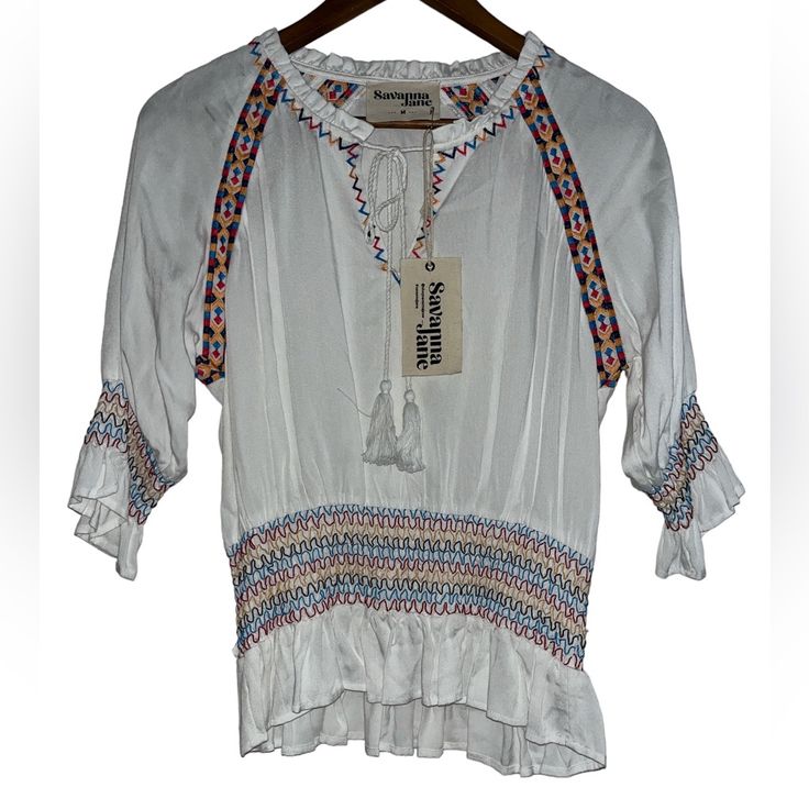 Size Medium New With Tags Short Sleeves 100% Rayon White Bohemian Embroidered Top For Summer, White Embroidered Top For Spring Festival, White Embroidered Blouse For Vacation, Spring Vacation White Embroidered Top, White Embroidered Top For Vacation, White Embroidered Top For Spring Vacation, Spring White V-neck Embroidered Top, White Embroidered Top For Summer, White V-neck Embroidered Top For Spring