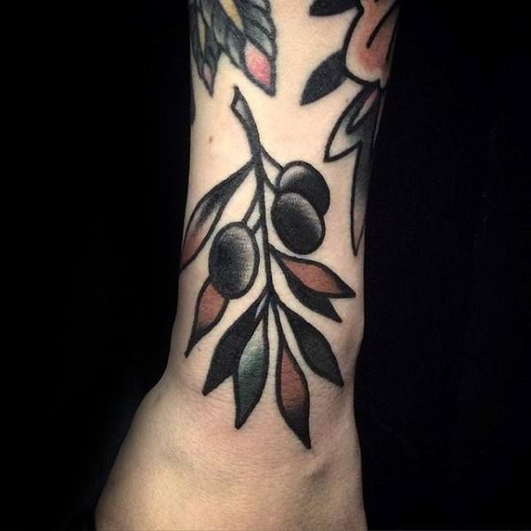 an olive branch tattoo on the wrist with leaves and flowers around it, done by me