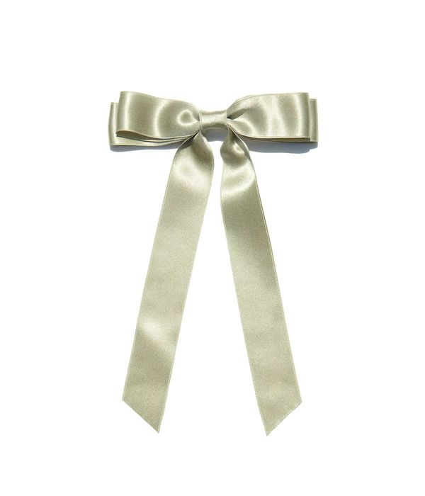 a white bow tied to the side of a wall