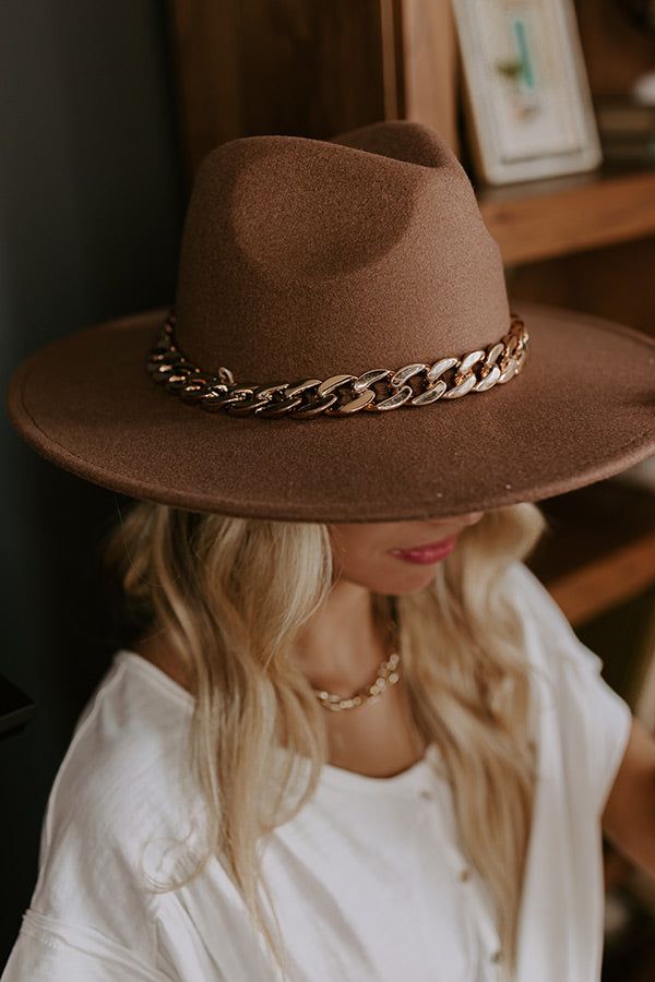 Top off your fall wardrobe in the best and most stylish way with our chic iced latte colored 'Love Of Lattes hat featuring soft lightweight felt material, a wide 4-inch brim, and a large gold chain link accent band! Length: 15.5 inches Width: 14.5 inches Height: 5 inches Cranial Circumference: 22.5 inches Chic Brown Felt Hat For Spring, Chic Brown Felt Hat For Winter, Gold Fedora With Flat Brim For Fall, Fall Gold Fedora With Flat Brim, Gold Flat Brim Fedora For Fall, Chic Brown Winter Hats, Chic Gold Wide Brim Fedora, Chic Brown Brimmed Fedora, Chic Brown Hat For Fall