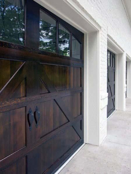 an image of a garage door that is painted dark brown and has white trim on it