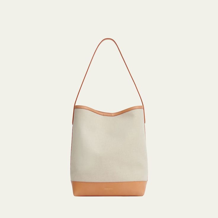 Mansur Gavriel everyday hobo bag in linen and cotton  Shoulder strap, 11" drop Open top with magnetic closure  Approx. 13.4"H x 10.4"W x 6.7"D Made in Italy Canvas Double Handle Shoulder Bag For Errands, Canvas Shoulder Bag With Double Handle For Errands, Canvas Bucket Shoulder Bag, Canvas Tote Shoulder Bag For Errands, Everyday Bucket Bag With Canvas Lining, Beige Canvas Bucket Shoulder Bag, Canvas Hobo Satchel Bag For Daily Use, Everyday Beige Hobo Bag With Leather Handles, Neutral Hobo Shoulder Bag With Adjustable Strap