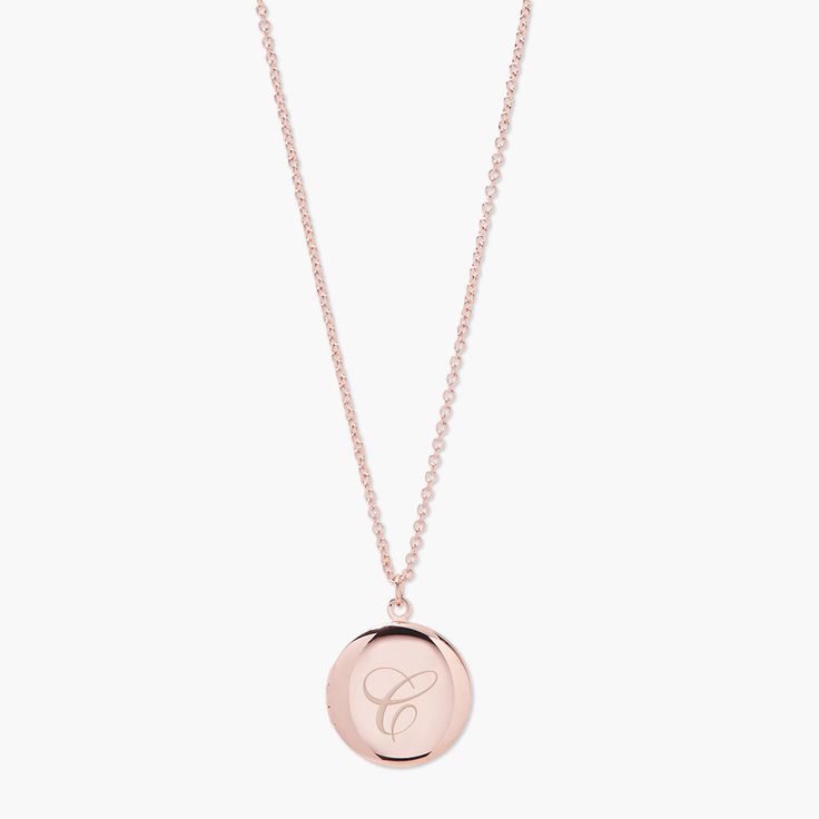 The Isla Long Locket offers the elegance and romance of a bygone era updated for modern times. Add your initial or monogram in your choice of script, and choose between yellow gold, rose gold, or rhodium plating for a high shine finish—a sweet and stylish way to keep a beloved photo close by. Available in 14k gold plated, rhodium plated or 14k rose gold plated brass 3/4" locket 30" cable chain with 2" extender Lobster claw closure Made in the USA With engraving this item is FINAL SALE SKU: BYN10 Formal Initial Pendant Necklace With Monogram, Formal Monogram Initial Pendant Necklace, Formal Monogram Initial Necklace, Classic Initial Necklace For Formal Occasions, Elegant Silver Initial Necklace With Monogram, Elegant Silver Monogram Initial Necklace, Classic Monogram Initial Necklace In Yellow Gold, Classic Yellow Gold Monogram Initial Necklace, Classic Initial Necklace As A Gift