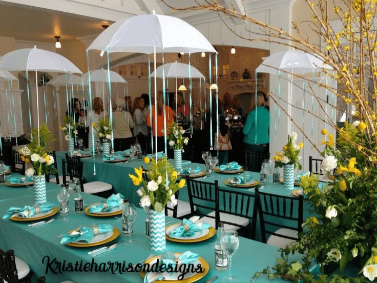 the tables are set with umbrellas for an event