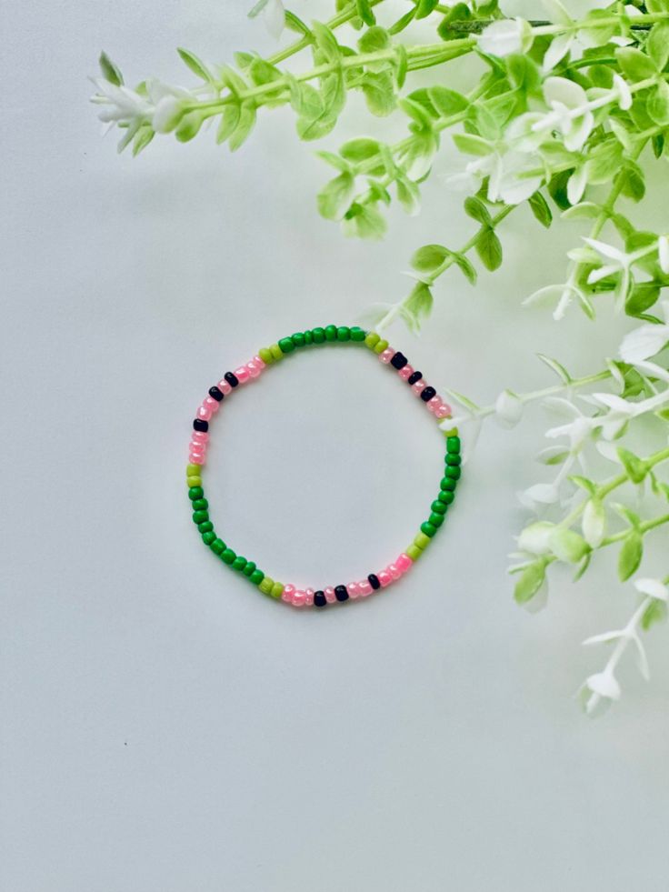 This bracelet is perfect for watermelon lovers Adjustable Green Stackable Beaded Bracelets, Adjustable Stackable Green Beaded Bracelets, Trendy Green Stretch Bracelet Stackable, Stackable Green Beaded Bracelets, Trendy Green Stackable Jewelry, Trendy Green Stackable Stretch Bracelet, Green Stackable Stretch Bracelet For Beach, Casual Green Stackable Bracelets, Trendy Green Bracelets With Colorful Beads