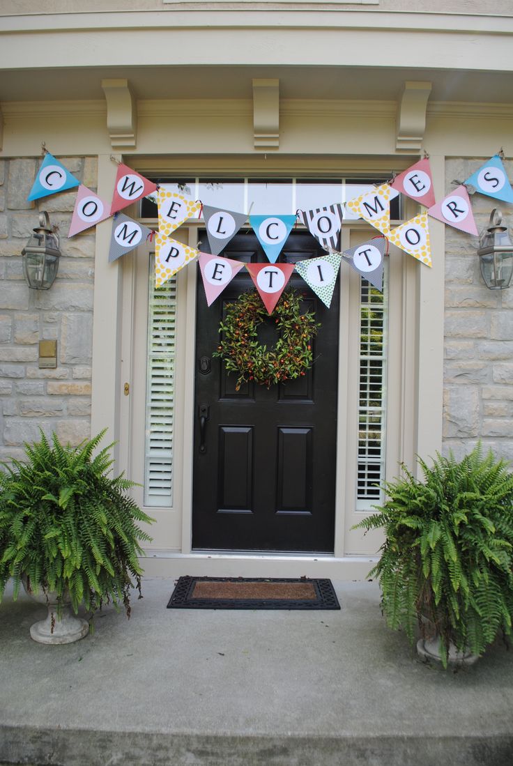 a welcome home banner hanging on the front door