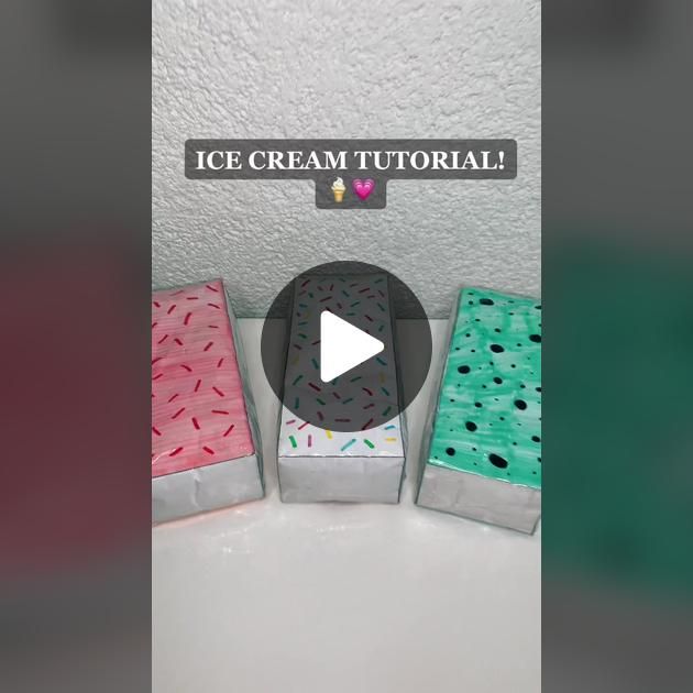 three ice cream boxes sitting next to each other on top of a white countertop