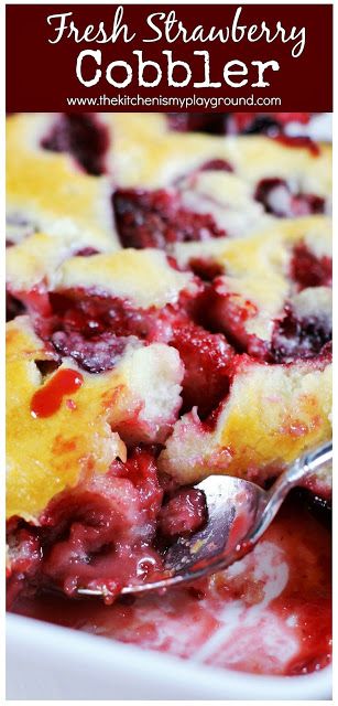 fresh strawberry cobbler in a white dish with a serving spoon on the side and text overlay that reads fresh strawberry cobbler