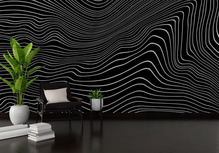 a black and white wallpaper with wavy lines on it, next to a chair