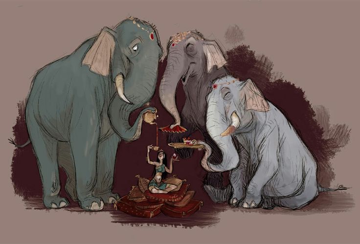 three elephants standing next to each other in front of a person sitting on the ground