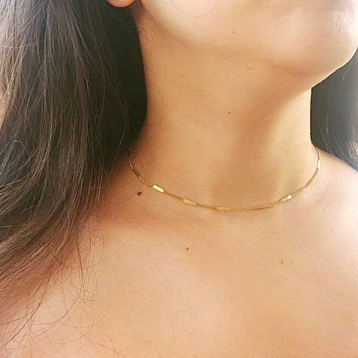 "Dainty gold choker necklace. Perfect to wear alone or for layering with more necklaces. Feel free to contact me for details & options. You can attach it with another layered necklace: ♥https://www.etsy.com/il-en/listing/628526854/minimal-14k-gold-filled-stardust-bead or: ♥https://www.etsy.com/il-en/listing/627506582/lariat-necklace-gold-diamond-north-star Details: 14K Gold-filled Tiny Tubes chain. Gold filled spring clasp and links Length: At checkout, please pick your desired length Length Minimalist Yellow Gold Tarnish Resistant Choker, Minimalist Yellow Gold Choker With Adjustable Chain, Dainty Yellow Gold Choker For Everyday Wear, Dainty Gold-plated Choker With Clavicle Chain, Minimalist Yellow Gold Choker With Delicate Chain, Delicate Yellow Gold Choker With Chain, Gold Minimalist Tarnish Resistant Choker, Delicate Yellow Gold Choker With Delicate Chain, Gold Tarnish Resistant Minimalist Choker