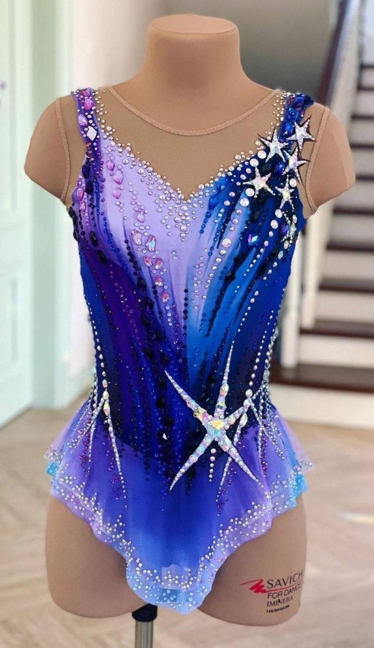 a mannequin wearing a blue and purple leotard with stars on it