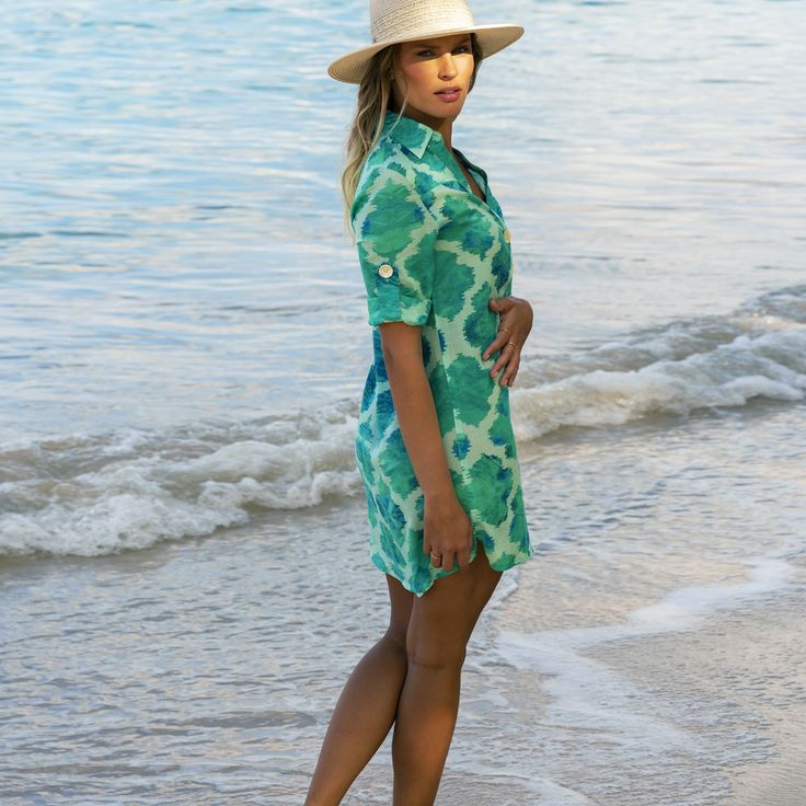 The Jade Paradise beach shirt has a flattering collared v-neckline with a button-down design that is loosely structured, keeping you effortlessly cool in the sun. This above the knee style has adjustable sleeves with button fastening, a curved hem that falls slightly longer at the back and features large pearlescent buttons.  Made from breathable, lightweight rayon fabric, this beach shirt is great for travelling and is easy to care for (gentle machine wash).   This summer staple is perfect for V-neck Shirt Dress For Beach Season, Spring V-neck Hawaiian Shirt, Casual V-neck Shirt Dress For Vacation, Summer V-neck Hawaiian Shirt, Summer Beach Hawaiian Button-up Shirt, Summer Hawaiian Beach Shirt Button-up, Summer Hawaiian Button-up Shirt For Beach, Summer Beach Hawaiian Shirt, Summer Button-up Hawaiian Shirt For Beach