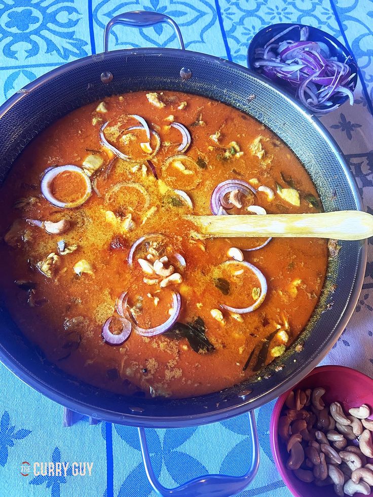 a pan filled with food sitting on top of a table