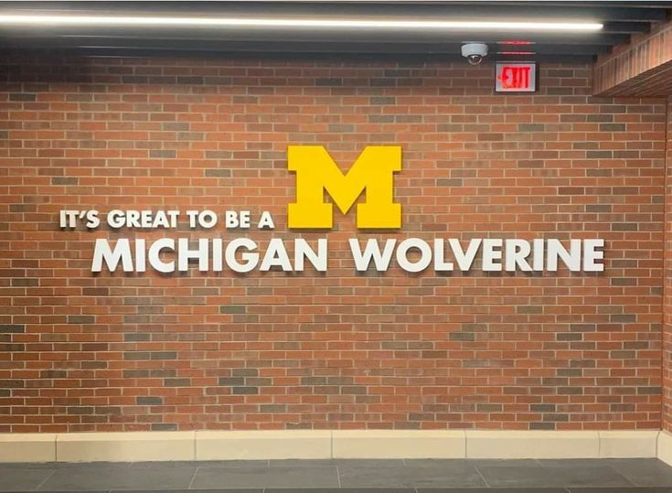 it's great to be a michigan wolverine sign on the side of a building