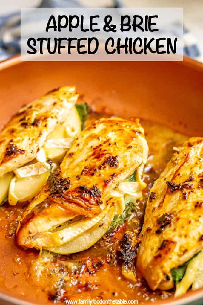 grilled chicken with apple and brie sauce in a pan