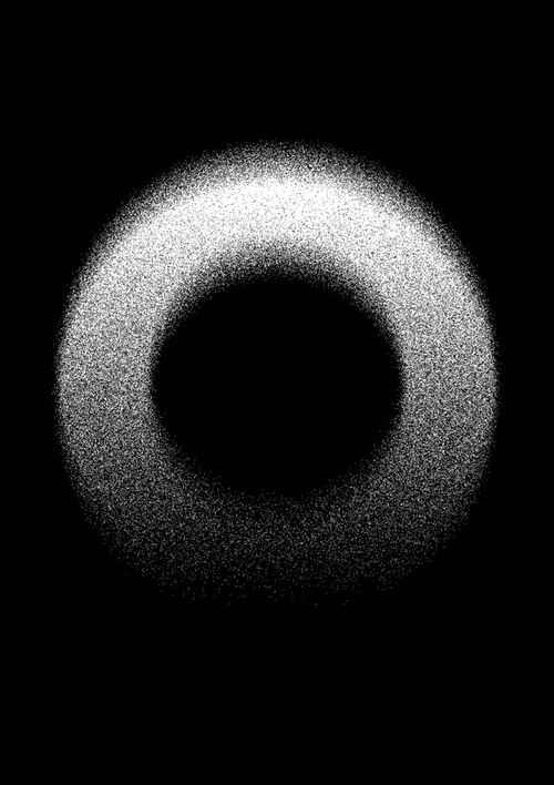 a black and white photo of a circular object in the dark space with light coming from it