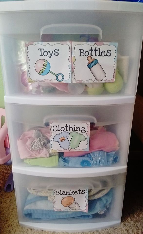 three plastic bins with labels on them that say toys, bottles, blankets and diapers