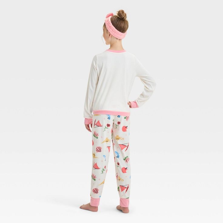 Elevate your child's wardrobe with this Disney Princess 2-Piece Pajama Set and Headband in white. This pack includes a headband, a polyester long-sleeve sleep shirt with a Disney princess print designed in a crew neckline, and a pajama pant with allover Disney-themed prints—for a fan-favorite look. Tailored in a regular fit, this pajama set is great for casual evenings or just lounging at home. Cute White Character Print Sleepwear, Cute White Sleepwear With Character Print, Casual White Sleepwear With Character Print, White Loungewear Sets With Elastic Waistband, White Cotton Sets With Character Print, White Character Print Bedtime Sets, White Character Print Playwear Sets, White Character Print Sets For Bedtime, White Playwear Set With Character Print