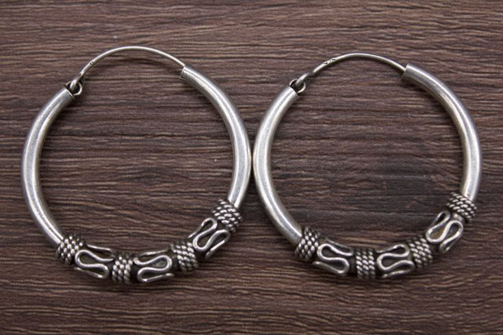 A rare pair of large size pure silver earrings. It has a unique design. These well-made earrings are worn by women of various tribal groups for centuries. Oxidize silver, in good condition. Wt: 7.28g Origin: Nepal 20th c Ethnic Earring, ethnic jewelry, Tribal Art, tribal Jewelry, Nepali jewelry, Antique Jewelry, collectibles, buddhabeadandantique, silver jewelry, handicraft, protective necklace, Silver Earring, Earring Silver Temple Jewelry Hoop Earrings, Traditional Silver Hoop Earrings, Silver Traditional Hoop Earrings, Traditional Engraved Round Hoop Earrings, Traditional Engraved Hoop Earrings, Traditional Silver Hoop Earrings For Festival, Traditional Round Engraved Earrings, Traditional Engraved Round Earrings, Traditional Sterling Silver Earrings For Festivals