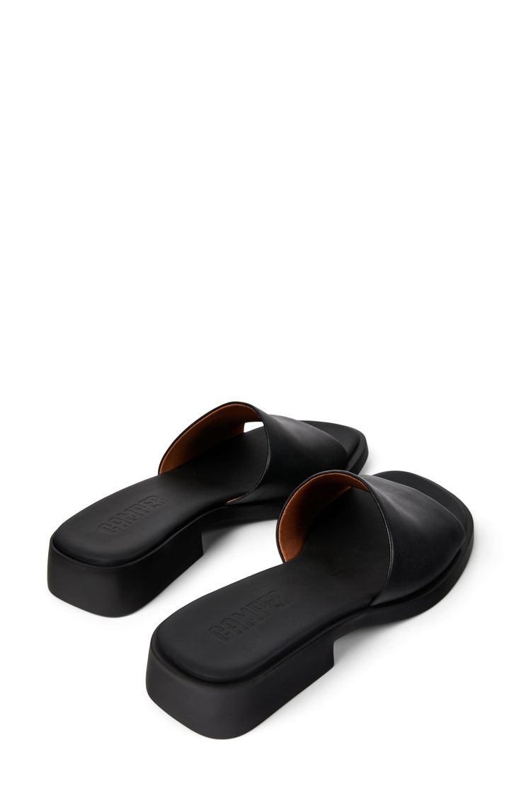 A wide leather strap sweeps across this contemporary sandal crafted with a lightweight feel and durability for everyday comfort. 1 1/4" heel (size 39) Leather upper and lining/synthetic sole Imported Classic Slip-on Sandals With Flat Heel, Leather Mules With Cushioned Footbed And Low Heel, Modern Sandals With Cushioned Footbed Medium Width, Modern Sandals With Cushioned Footbed, Modern Synthetic Sandals With Leather Sole, Modern Cushioned Sandals Medium Width, Medium Width Open Toe Sandals With Rubber Sole, Slip-on Leather Sandals With Low Heel, Synthetic Sandals With Leather Sole And Block Heel