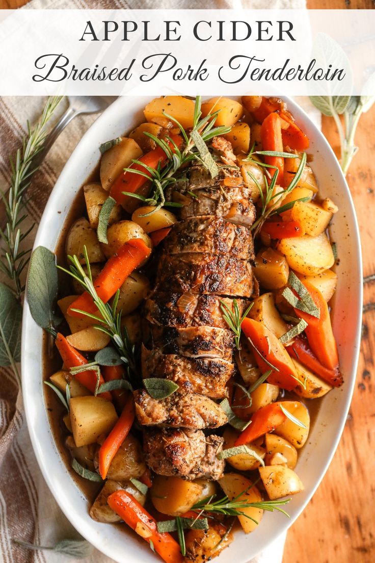 an apple cider braised pork with potatoes and carrots in a white bowl