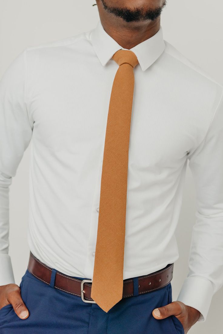 We pride ourselves in offering our customers some of the best skinny ties money can buy. Each DAZI tie is handmade from high quality imported fabrics. Features: Approx. 2.5" wide at the tip Approx. 58" in length 50% Cotton, 50% Linen