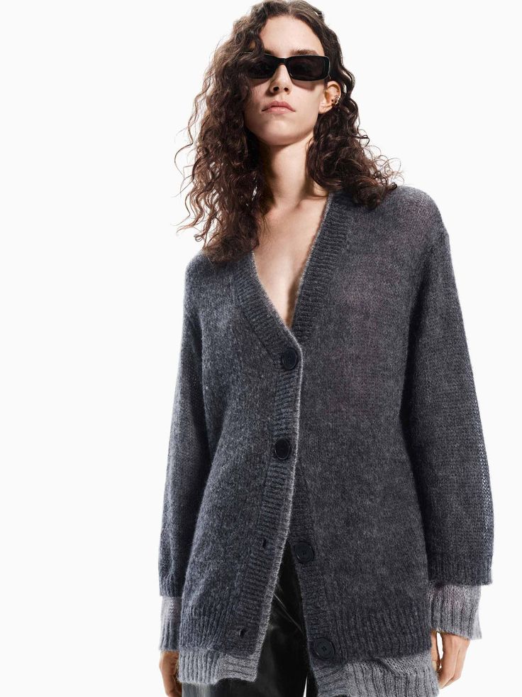 MO&Co. Women's Layered Detail Loose Cardigan Crafted with a soft and fluffy touch from a blend of wool, mohair, and polyamide. This V-neck cardigan features a unique layered design with a contrasting ribbed trim for added style. Cut in loose shape it's the perfect addition to your fall and winter wardrobe. Features : - Loose fit, fluffy touch- V-neck and button closure- Layered design with contrasting- Made from wool, mohair and other fiber blends Code: MBD3CAR006The back length of size S is 70cmMATERIALS & CARE Material: 39.0% Polyamide 36.6% Wool 24.4% MohairPlease put it into a mesh bag to wash.REMINDER: All items are measured manually. Please note that it's reasonable that there might be minor measurement differences (1-2cm) on some items. Casual Mohair V-neck Outerwear, Spring Mohair V-neck Cardigan, Cozy Mohair V-neck Cardigan, Soft Knit V-neck Sweater Coat For Layering, V-neck Sweater Coat For Layering, Cozy Fine Knit Outerwear For Layering, V-neck Cashmere Sweater Coat For Layering, Soft Textured V-neck Outerwear For Fall, V-neck Winter Cardigan With Soft Texture