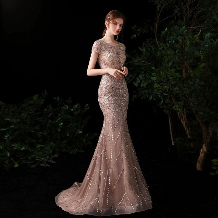 Backless Mermaid Dress With Sweep Train, Elegant Evening Wedding Dress With Mermaid Hem, Elegant Backless Mermaid Evening Dress, Glamorous Backless Evening Dress With Sweep Train, Glamorous Sleeveless Wedding Dress For Prom Season, Backless Mermaid Wedding Dress For Prom Season, Embellished Fishtail Evening Dress For Wedding, Backless Mermaid Evening Dress For Prom, Elegant Fitted Mermaid Wedding Dress