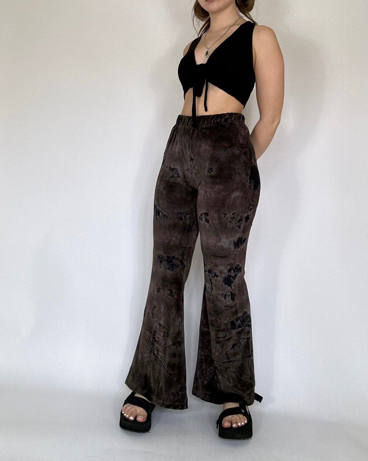 The Gianna Pants are designed with a velour fabric that provides both a luxurious feel and a comfortable fit. Featuring an elastic waistband and flared fit, these pants offer a retro silhouette. Model is 5’2 and wearing a S/M Velvet Bottoms For Fall Loungewear, Trendy Flare Pants For Loungewear, Relaxed Fit Flare Pants For Fall, Trendy Relaxed Fit Flare Pants, Stretch Velvet Bottoms For Fall, Casual Velvet Bottoms For Fall, Fall Velvet Bottoms For Loungewear, Trendy Velvet Pants For Fall, Fitted High Waist Velvet Bottoms