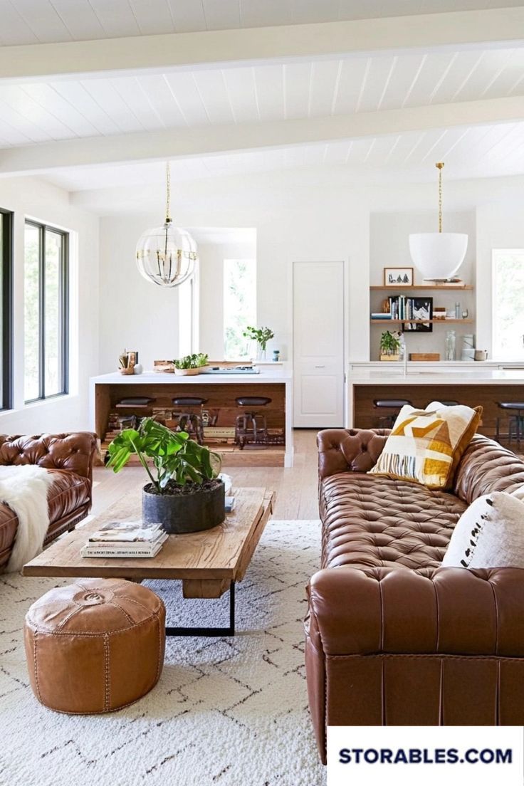 Make your living room warm and inviting with brown leather furniture. Get creative decor ideas at storables.com. How do you make your brown leather pieces stand out? #LivingRoomIdeas #BrownLeatherFurniture #HomeStyling #DecorInspo #InteriorDecor White Living Room Brown Leather Couch, Dark Brown Leather Couch Living Room White Walls, Brown Leather Loveseat Living Room, Brown Leather Furniture Color Schemes, Light Brown Leather Couch Living Room, Cognac Living Room, Leather Couch Living Room Modern, Light Brown Leather Couch, Leather Couch Living Room Decor