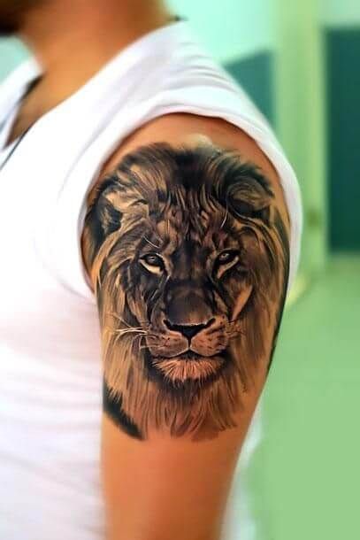 a man with a lion tattoo on his arm