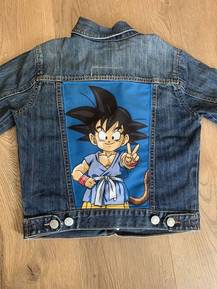 a denim jacket with an image of gohan on it