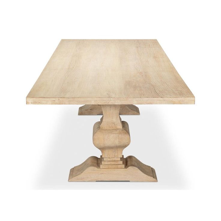 a wooden table with two pedestals on the top and one at the base, against a white background