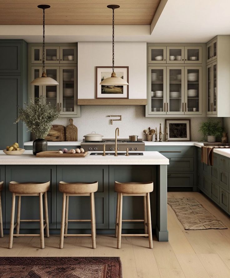 a kitchen with green cabinets and stools next to an island in front of a sink