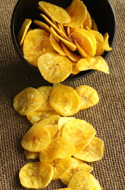 a black bowl filled with sliced bananas on top of a table