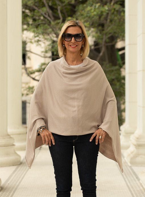 This On Trendy Beige Pull On Poncho is a must have Knitted in a soft beige color yarn Yarn content: 100% Acrylic Color: Beige Pull on body Can be worn a few different ways for a stylish modern clean look Chic Poncho For Layering, Chic One-size Poncho For Layering, Elegant One-size Poncho For Layering, Elegant One Size Poncho For Layering, Elegant Solid Poncho For Fall, Chic Beige Stretch Outerwear, Chic Stretch Beige Outerwear, Chic Solid Color Winter Poncho, Cozy Stretch Beige Outerwear