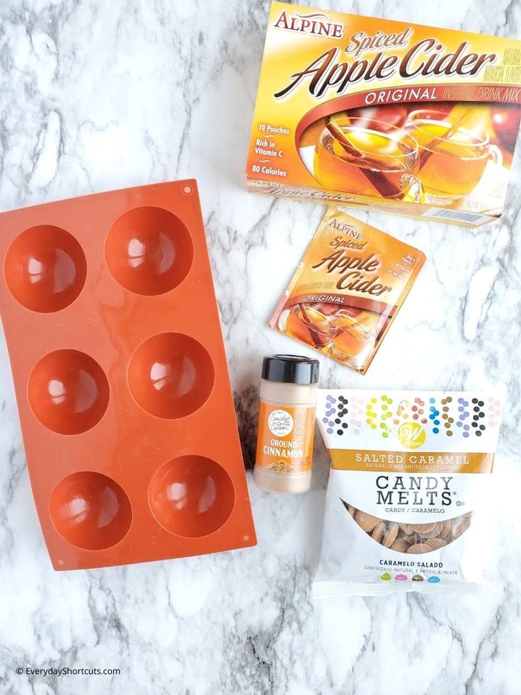 the ingredients needed to make an apple cider cake are displayed on a marble countertop