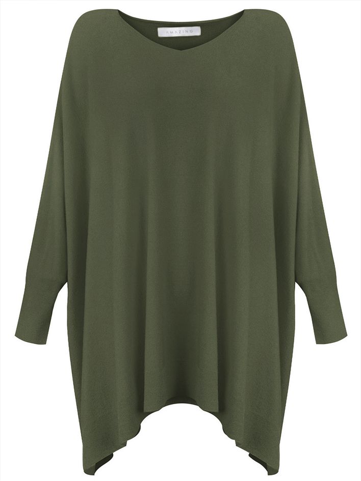 This oversized top features a round neckline, boxy shape, and long sleeves for a comfortable and relaxed look. With side slits and ribbed detailing around the hem, it offers both style and practicality. Perfect for any casual occasion, this top is a must-have for a laid-back, effortless look. Suggested for sizes 4-16 50% Viscose, 27% Polyester, 23% Polyamide Hand Wash Cold Measurements: Bust: 101" around, Length: 30 1/2" Solid Boxy Fit Sweater With Drop Shoulder, Oversized Crew Neck Knit Top With Ribbed Cuffs, Oversized Knit Top With Ribbed Cuffs And Crew Neck, Oversized Fine Knit Crew Neck Top, Oversized Crew Neck Knit Top, Oversized Ribbed Batwing Sleeve Top, Oversized Ribbed Top With Batwing Sleeves, Oversized Fine Knit Turtleneck Top, Oversized Ribbed Top