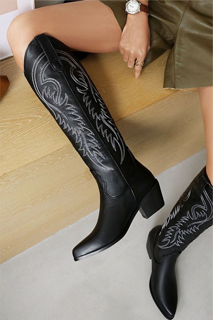 Girl, get ready to step up your shoe game with these Black Cowboy Boots! These babies are the perfect combination of fierce and fabulous, and will have you strutting with confidence wherever you go. Crafted from high-quality materials, these knee high boots are built to last and can handle any adventure you throw their way. The knee high length provides extra coverage, making them the perfect choice for any occasion, whether you're hitting up a country concert or just running errands in style. A Trendy Black Knee-high Boots With Round Toe, Western Style Black Knee-high Boots Medium Width, Black Knee-high Moto Boots For Winter, Black Western Style Knee-high Boots Medium Width, Black Round Toe Knee-high Boots For Fall, Black Western Knee-high Boots Medium Width, Black Mid-calf Boots For Fall, Trendy Black High Ankle Boots, Western Black High Heel Knee-high Boots