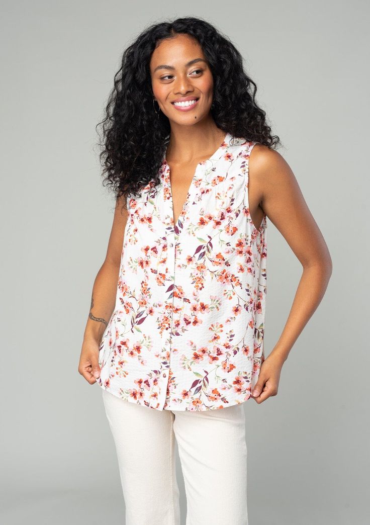 A classic sleeveless spring blouse in a natural and rose pink floral print. Floral print Relaxed fit Sleeveless Hip length Split neckline Banded collar Self-covered button front Classic spring blouse Polished enough for the office but laid-back enough for the weekend, our classic spring blouse is designed in an ultra-pretty floral print. With a split v-neckline and a delicate self-covered button front. Model is 5'8, wearing a size S.Style: I-15020W-SDT-FV Feminine Summer Tops With Split Neck, Elegant Floral Print Top With Split Neck, Elegant Floral Print Split Neck Top, Versatile Sleeveless Spring Blouse, Feminine Floral Print Top With Split Neck, Elegant Floral Print Sleeveless Blouse, Elegant Sleeveless Blouse With Floral Print, Feminine Split Neck Blouse, Chic Floral Print Top With Split Neck