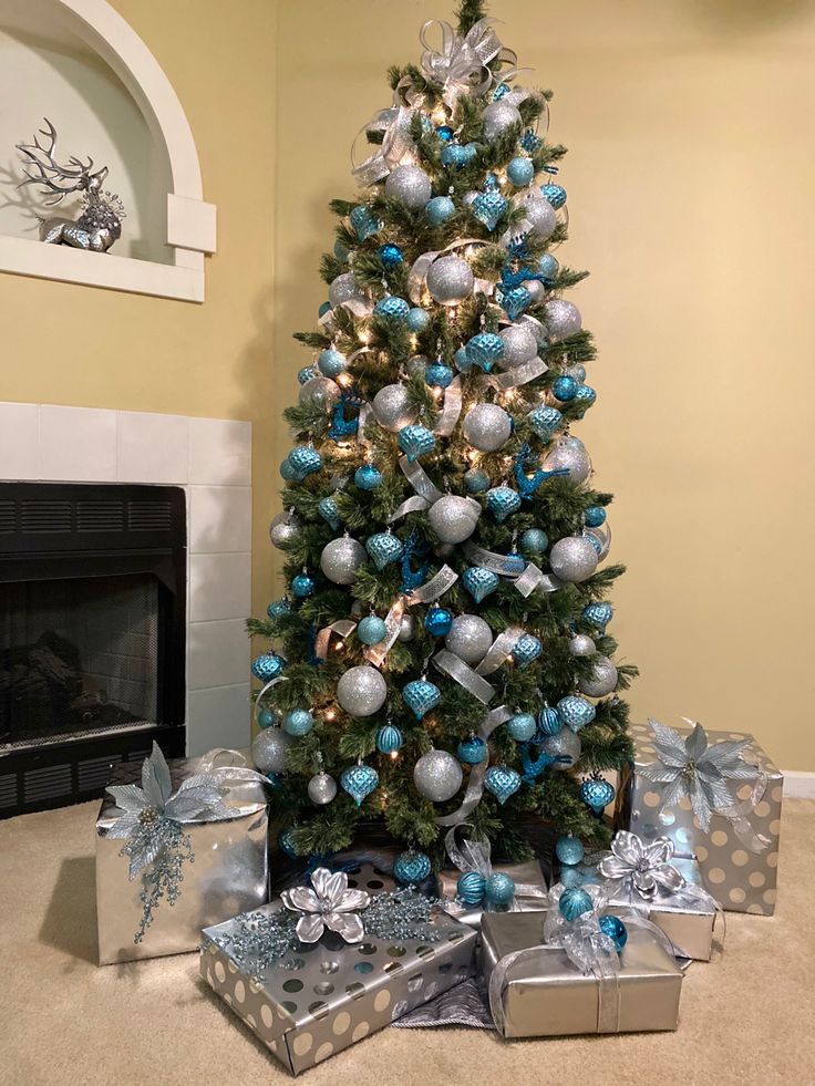 a christmas tree with blue and silver ornaments