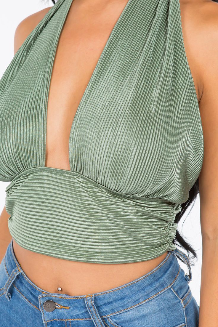 A crop top featuring a back-tie halter strap that crosses at the neck, fitted bodice, cropped length and luxe plisse fabrication.Fabric: 100% Polyester Made in: Los Angeles, USA Size Bust Waist Hips XS 32 24 - 25 33 - 34 S 34 - 35 26 - 27 35 - 36 M 36 - 37 28 - 29 38 - 40 L 38 - 39 30 - 31 42 - 44 Spring Triangle Top Halter For Night Out, Spring Triangle Halter Top For Night Out, Strappy Crop Top For Party, Chic Strappy Crop Top For Night Out, Triangle Halter Top For Night Out, Backless Crop Top For Spring Night Out, Strappy Crop Top With Crisscross Straps For Night Out, Trendy Strappy Halter Top For Night Out, Trendy Strappy Halter Top For Party