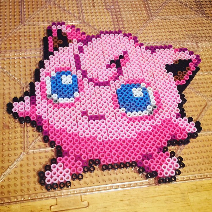 a pink hamster made out of plastic beads