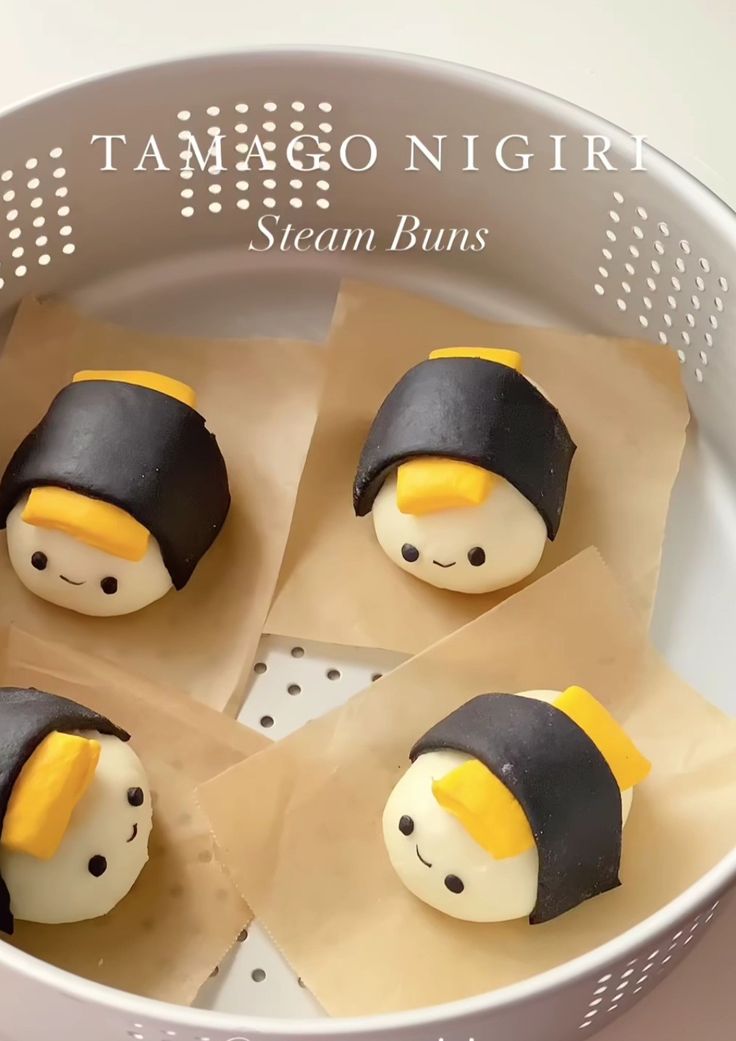 four small cakes in the shape of penguins