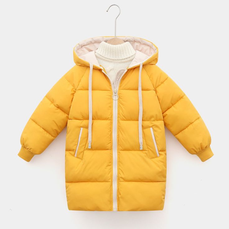 Keep your little one warm and cozy this winter. With a cotton-padded, thicken warm long jacket, your child will feel safe and secure in the winter months. The perfect combination of luxury and practicality, it's sure to become their favorite winter wear! The heavyweight design provides extra warmth during chilly winter days. Zipper closure for ease of wearing and added protection against the cold. Unisex style makes it suitable for both boys and girls. Long style offers extended coverage, keepin Cotton Puffer Jacket With Fleece Lining, Winter Wear Puffer Jacket, Warm Cotton Hooded Jacket For Winter, Winter Cotton Hooded Long Jacket, Winter Cotton Hooded Long Coat, Cotton Long Sleeve Puffer Jacket For Cold Weather, Long Sleeve Cotton Puffer Jacket For Cold Weather, Winter Long Cotton Hooded Jacket, Winter Long Coat Hooded Cotton Jacket