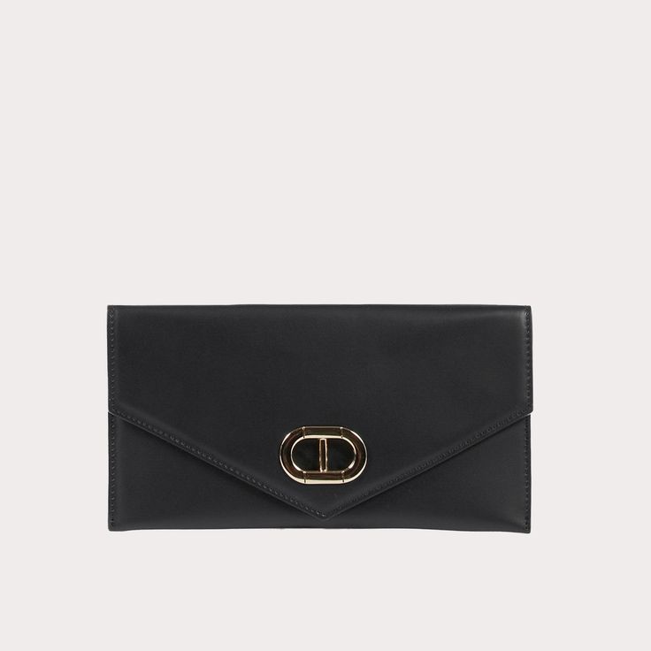 The Dee Ocleppo Leather Envelope Clutch is a sophisticated accessory crafted from premium leather, offering a timeless design that complements any ensemble. Its sleek envelope shape, combined with a secure snap closure, makes it both stylish and practical for day-to-night wear. Elevate your look with this elegant clutch, perfect for carrying your essentials with effortless charm. - Made in Italy - 100% Leather - Dimensions: 11x6x2.75 inches (28x15x7cm) - Fully lined suede interior - Zipped inter Timeless Business Clutch With Removable Pouch, Elegant Bifold Wallet With Magnetic Closure, Elegant Leather Clutch With Fold Over Clasp, Classic Envelope Work Bag, Elegant Office Clutch With Magnetic Closure, Elegant Bifold Wallet For Office, Elegant Workwear Clutch With Removable Pouch, Modern Office Clutch Wallet, Chic Bifold Business Wallet