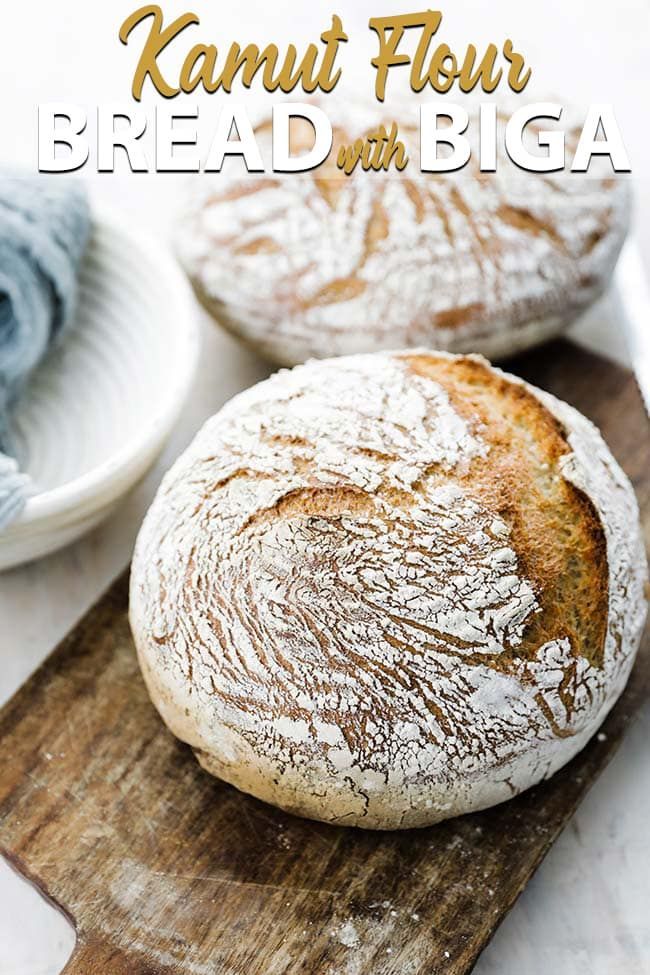 two loaves of bread sitting on top of a cutting board