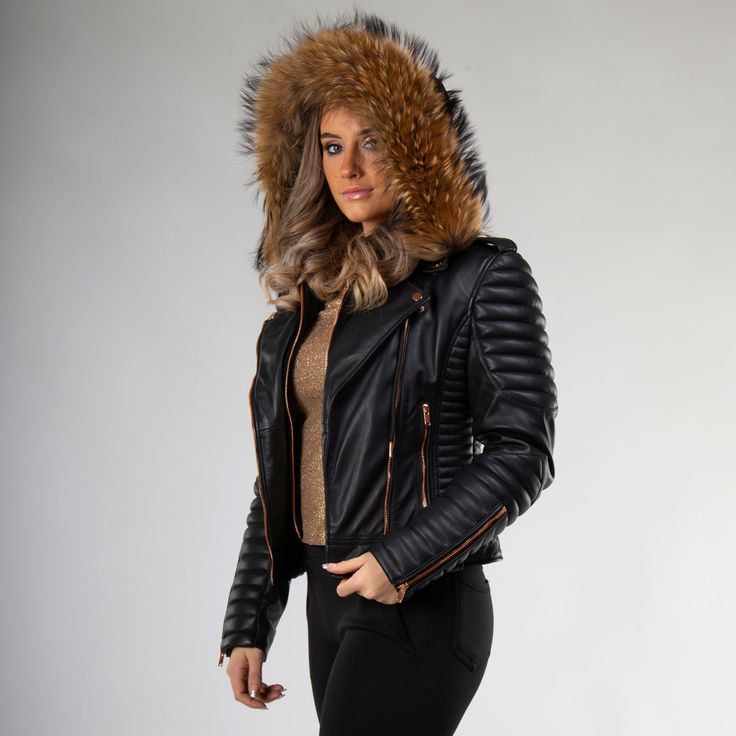 Gasoline | Wind Chill is our most gorgeous line among Moto Style Leather Jackets. The glittering Rose Gold hardwares toned with super fluffy natural raccoon fur presents the ultimate contemporary style every woman desires for. The black Gasoline jacket has been handcrafted with perfection in a classic bikers style from butter-soft sheepskin leather. Removable Hood and Fur - both are detachable and can be taken off when not needed. Wear it with or without Hood or Fur. The silky, luxurious feel of Quilted Sleeves, Cotton Lycra Fabric, Wind Chill, Lambskin Jacket, Leather Jacket With Hood, Winter Attire, Leather Industry, Lady Riders, Black Motorcycle